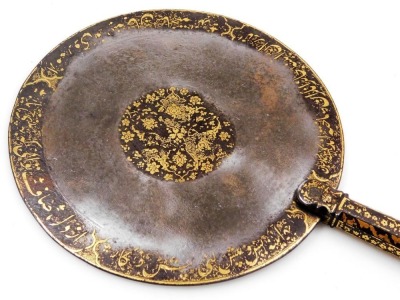 A 14th/15thC Persian steel hand mirror, Ilkhanid or Timurid gold inlaid script and floral decoration to the circular panel and handle, one side partially polished, 17cm diameter, 34cm overall length. - 2