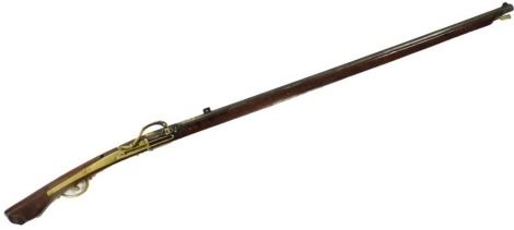 A Japanese matchlock musket (Tanegashima), the octagonal steel barrel, 100cm long, inlaid with a dragon in brass, with brass furnishings and ramrod terminal, 136cm long overall.