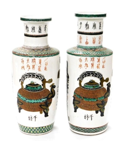 A pair of Qing Dynasty associated famille vert porcelain vases, of shouldered ovoid form, decorated with a bronze drinking vessel, kettle, and an altar table, calligraphy, etc., 47cm high.