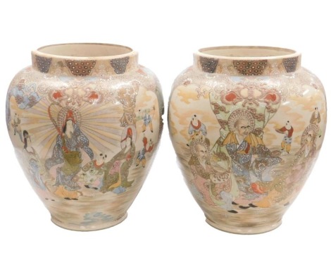 A pair of Meiji period Japanese Satsuma vases, each of cylindrical tapering form, decorated with deities and attendants, unmarked, 39cm high.