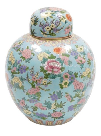 A 20thC Chinese famille rose porcelain ginger jar and cover, decorated with flowers in coloured enamels, against a turquoise ground, red seal mark to underside, 34cm high.