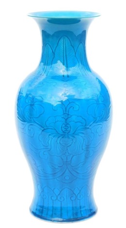 A Chinese porcelain turquoise glaze vase, of baluster form, incised with flowers and leaves, unmarked, 35cm high.