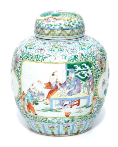 A Chinese porcelain famille verte ginger jar and cover, decorated with reserves of figures in interior scene, flowering branches, etc., unmarked, 23cm high.