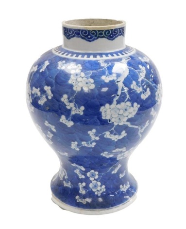 A 19thC Qing Dynasty blue and white porcelain vase, of baluster form, decorated with prunus blossom on a cracked ice ground, 35cm high.