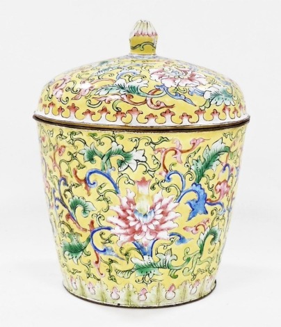 A Chinese Canton enamel box and cover, of tapering cylindrical form, decorated with flowers and scrolling leaves, on a yellow ground, 15.5cm high.