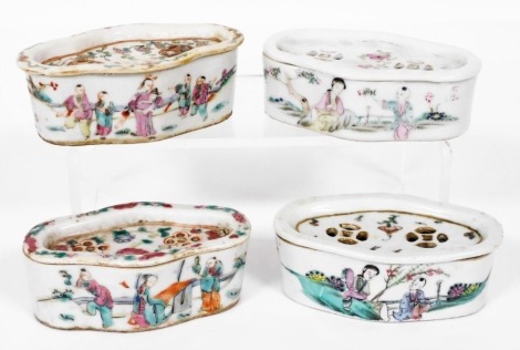 Four Chinese famille rose porcelain cricket boxes and covers, circa 1900, of oblong form, painted with figures, flowers, and Chinese characters.