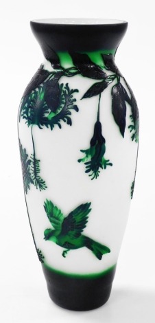 A Chinese cameo glass vase, decorated in relief with birds, flowers and leaves in tones of green against a white ground, 30cm high.