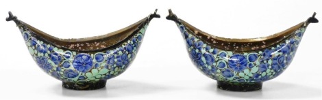 A pair of Kashkul painted lacquer and brass beggar's bowls, of boat shaped form, painted with flowers, 16cm wide.