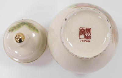 A group of Japanese and Chinese porcelain and pottery, including a Satsuma koro and cover, vase and cover, figure of a Japanese lady playing a samisen, and a Chinese porcelain chocolate cup and cover. (a quantity) - 11