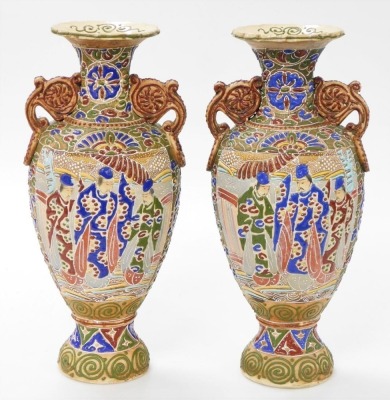 A pair of Meiji period Japanese Satsuma moriage vases, of twin handled baluster form, decorated with panels of priests, on a ground of flowers and scrolls, 39cm high.