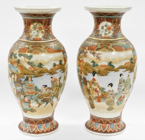 A pair of Meiji period Japanese Satsuma vases, decorated with reserves of ladies by a lake, and samurai in a landscape setting, within a floral ground, signed to the base, 36.5cm high.