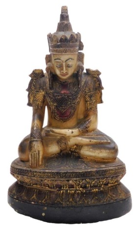 A Tibetan hardstone figure of Vajrasattva Buddha, with painted and gilded decoration, modelled seated on a lotus flower base, 36cm high.