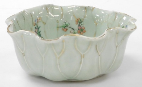 A 19thC celadon porcelain bowl, modelled as a lily pad, enamelled with flowers, 17cm wide