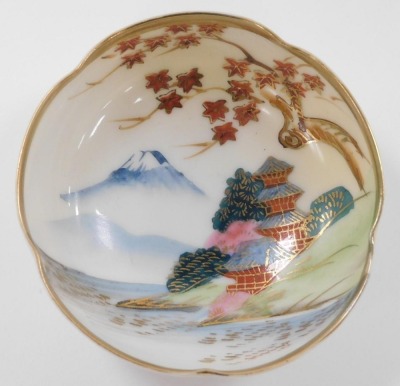 An early 20thC group of Japanese porcelain, including eight dishes painted with birds, and a bowl painted with a mountain landscape. (a quantity) - 5