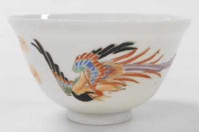 A group of Chinese and Japanese porcelain, including Japanese plates painted with birds and flowers, tea bowls, and a Chia Ching blue and white saucer. (a quantity) - 9