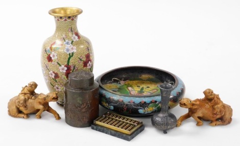 A group of Chinese metalwares, comprising a cloisonne vase decorated with prunus blossom on a yellow ground, 21cm high, cloisonne bowl decorated with dragons on a black ground, 20cm wide, bronzed metal tea canister, white metal vase, pair of wooden carvin