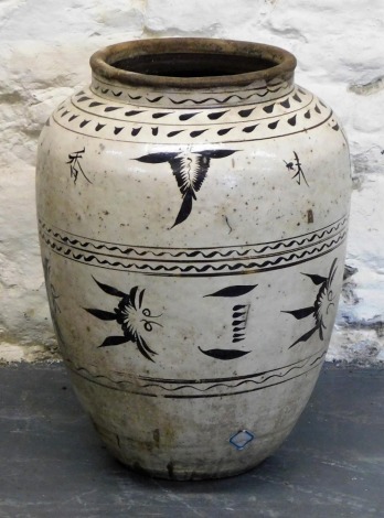 A large Chinese ovoid vase, decorated in the Song style with stylized leaf designs, 62cm high, 47cm diameter.