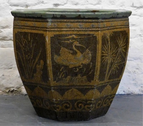 A Chinese octagonal jardiniere, 61cm high, 74cm diameter.