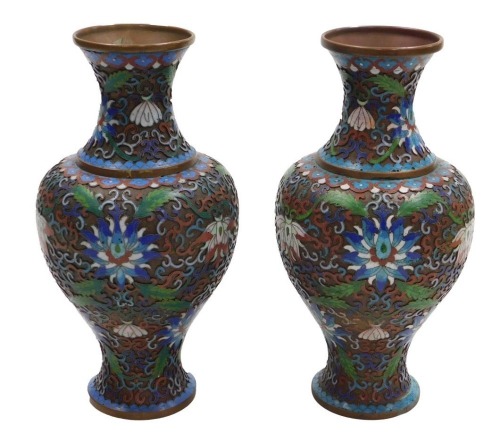 A pair of Chinese cloisonne baluster vases, enamelled on copper with a scrolling peony design and foliage, in polychrome enamels, 26cm high.