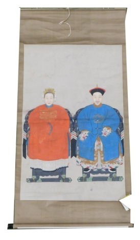 A Chinese ceremonial ancestor portrait scroll, depicting two seated family members, watercolour on silk, 208cm x 105cm.