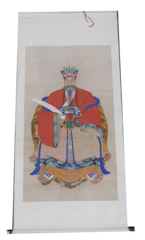 A Chinese ceremonial ancestor portrait scroll, depicting a Chinese Emperor dressed in a red robe, watercolour on silk, 218cm x 106cm.