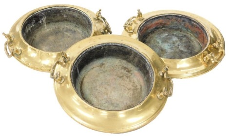 Three Middle Eastern brass brazier's, each with swing brass handles, approximately 43cm diameter.