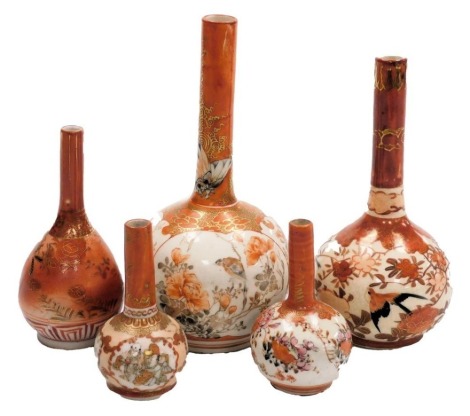 Five Meiji period Japanese Kutani ware bottle shaped vases, with elongated necks, each of differing design decorated with flowers, birds, figures, etc., the largest 18.5cm high.