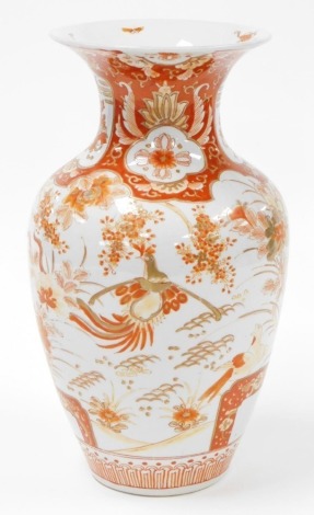 A Meiji period Japanese Kutani porcelain baluster vase, with orange flower and bird design, Meiji period, 34cm high.