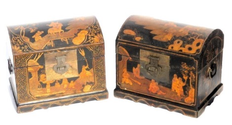 Two Chinese and black gilt lacquer domed boxes, decorated with panels of figures in a landscape, raised on a bracket base, 30cm high, 34cm wide, 36cm deep.