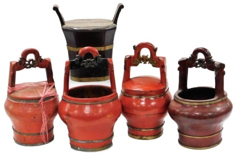 Five Chinese red lacquer wedding baskets, with carved handles, two with drop in lids.