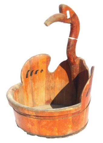 A Chinese wooden water barrel, with a carved bird's head over handle, 39.5cm wide.