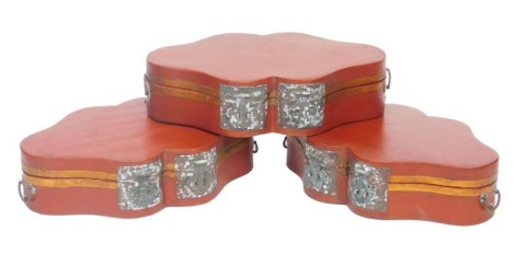 Three Chinese red and gilt lacquer boxes, of serpentine form, with twin carrying handles and double lock plates, each 40cm wide.