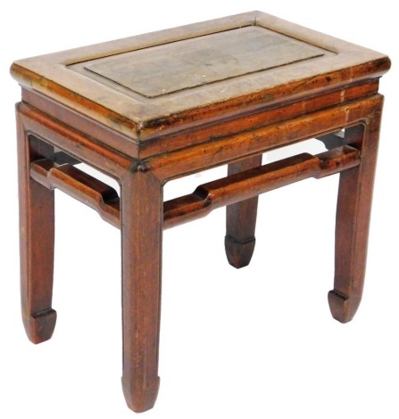 A Chinese hardwood occasional table, with pierced sides, raised on square legs, 50cm high, 52cm wide, 33cm deep.