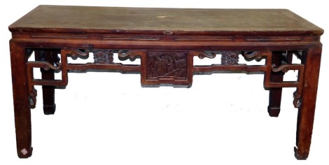 A Chinese table, with carved frieze, 85cm high, 188cm wide, 77cm deep.