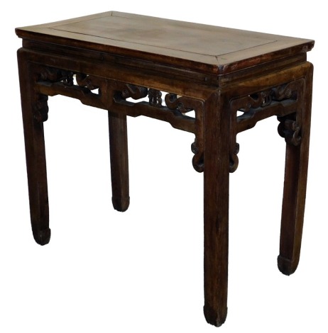 A Chinese table, with carved frieze, 82cm high, 92cm wide, 46cm deep.