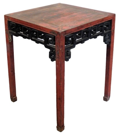 A Chinese red and black lacquer table, 84cm high, 66cm square.