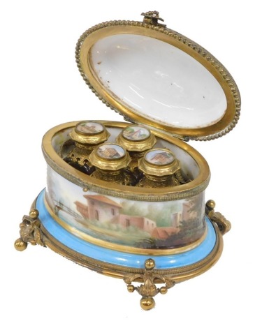 A 19thC French Sevres style porcelain and gilt metal perfume casket, of oval form, the hinged lid hand painted with rural scenes on a turquoise ground with gilt banding and raised bead decoration revealing a fitted interior, with four gilt metal glass bot