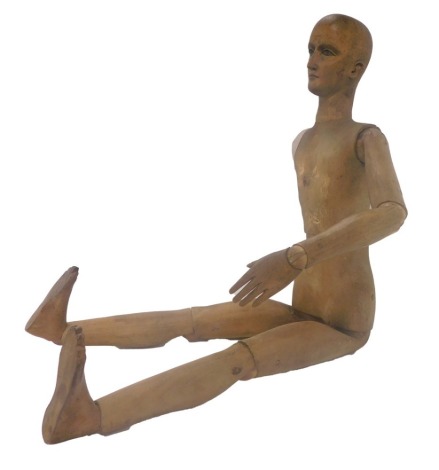 A late 19thC French artist's pine lay figure, with articulated limbs, unmarked, 58cm high. (AF)