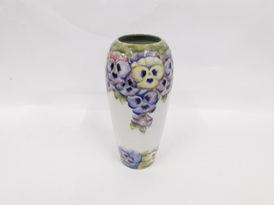 An early 20thC Macintyre Moorcroft pottery pansies pattern vase, on white ground, printed and script mark beneath, 32cm high. (AF) - 2