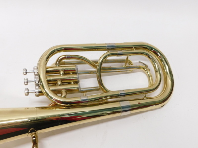 A brass tenor horn, JP73, with three valves, 58cm high, in John Packer case. - 3