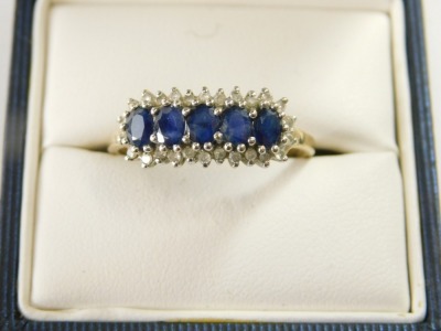 A sapphire and diamond ring in 9ct gold, size T-U, 3g all in. - 2