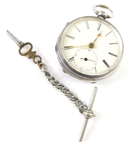 A Victorian silver open faced pocket watch, with 4cm diameter dial, subsidiary Arabic second hand, in engine turned case with vacant cartouche, Chester 1899, 7cm high, with key, 127g all in.