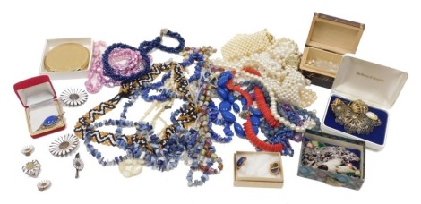 Various costume jewellery and effects, a powder compact, 8cm diameter, various brooches, Celtic style and others, faux pearls, various other brooches, filigree butterfly brooches, various beads, necklaces, lapis style and others, various other faux pearls