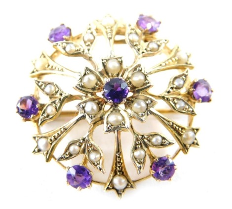 An Edwardian amethyst pendant brooch, florally set, unmarked, 4cm high. (boxed)