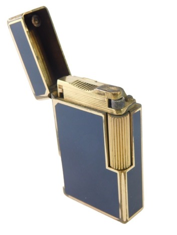 A 20thC Dupont pocket lighter, in blue, with gilt metal trim, marked beneath, 6cm high.