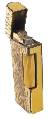 A 20thC Dunhill pocket lighter, with textured finish and yellow enamel sides, marked beneath, 7cm high.