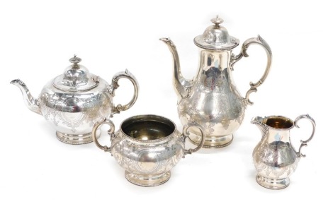 A Victorian silver four piece tea and coffee service, by Edward and John Barnard, comprising coffee pot, 29cm high, teapot, two handled sugar bowl and cream jug, each chased with scrolls and garlands on circular feet, London 1862 and 1863, 70oz all in. (