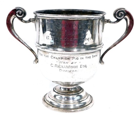 An George V silver two handled trophy, with bell shaped bowl, flanked by scroll handles, on circular foot, engraved Lincoln Christmas Fat Stock Show...1922, London 1921, 19cm high, 13oz.