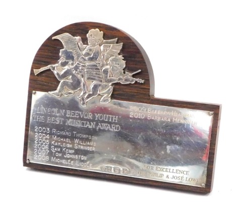 An Elizabeth II Lincoln Beevor Youth Music Awards silver plaque, on wooden back, Birmingham 1985, 16cm wide.