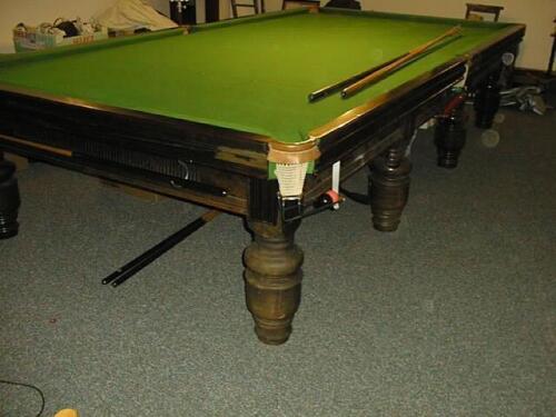 A full size mahogany Billiards Table